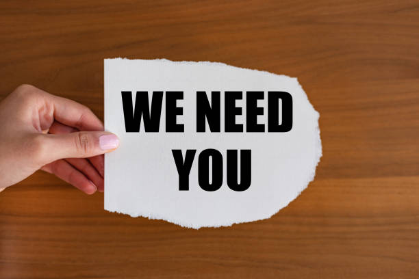 istock We need you - close up text on the slip. 1454628270