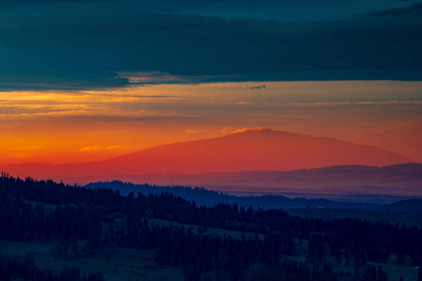 istock the colors of the setting sun in the mountains 1454629962