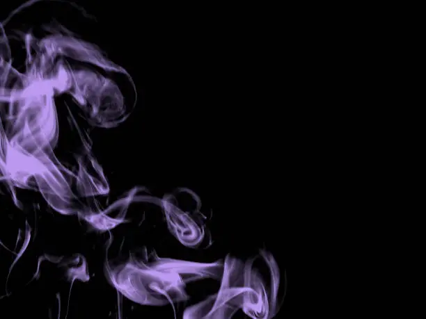 Colorful smoke on dark background.