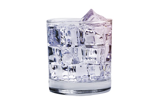 Glass of ice cubes cold fresh water for drink in summer isolated on white background with clipping path.