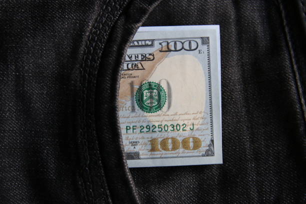 American dollars USD banknotes in jeans pocket. stock photo