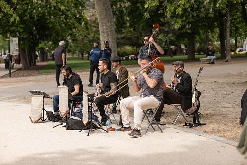 MADRID, Spain – May 02, 2022: A jazz band playing in the Retiro park in Madrid on a holiday