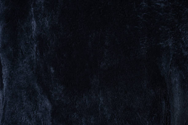 istock black sheepskin fur background 1454638781