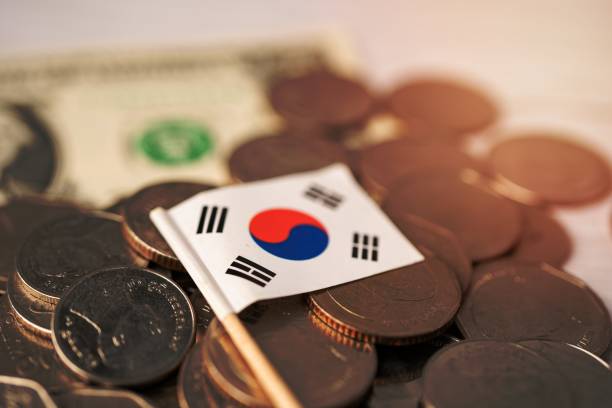 istock Stack of coins with Korea flag on white background. 1454640698