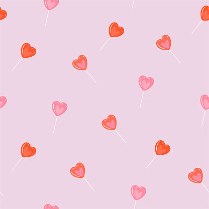 Seamless pattern with red and pink lollipop hearts. Vector image.