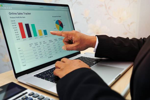 istock Asian accountant working and analyzing financial reports project accounting with chart graph and calculator in modern office, finance and business concept. 1454641958