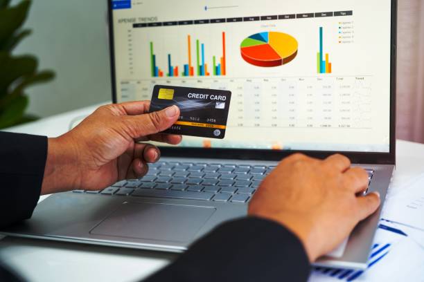 istock Asian accountant working, calculate and analyzing report project accounting with notebook and credit card in modern office, finance and business concept. 1454642186