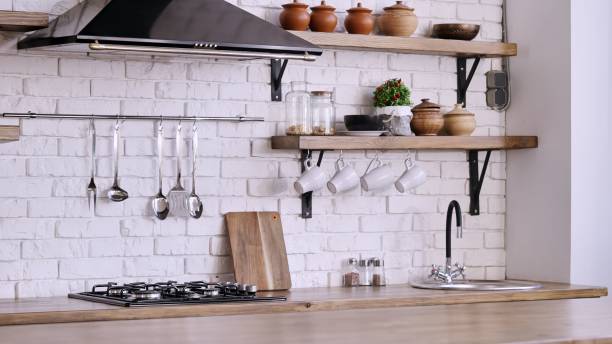 istock Interior design of cozy kitchen with white brick wall and range hod 1454645349