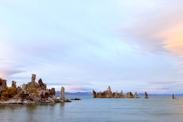 Fantastic colors over Mono Lake with lenticular clouds moving over it at a twilight stock photo