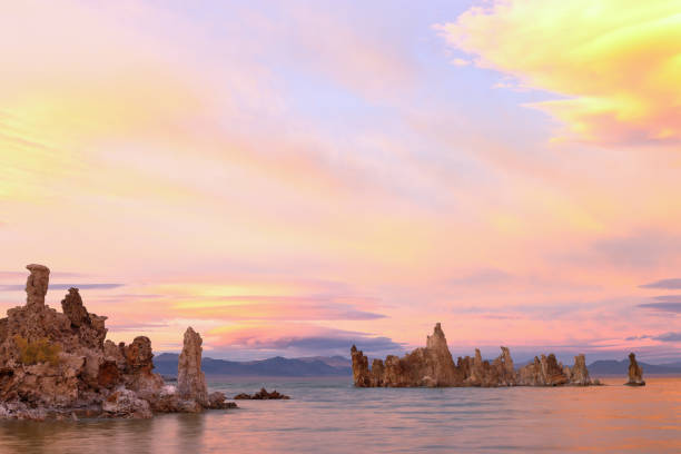 Fantastic colors over Mono Lake with lenticular clouds moving over it at a twilight stock photo
