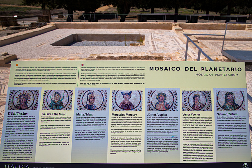 Santiponce, Spain - April 2, 2019: Mosaic of Planetarium. Informative panel in Spanish and English of this famous mosaic. Roman ruins of Italica. Spain.