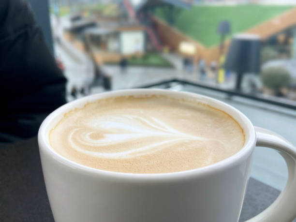 istock Coffee latte or cappuccino on the cafe table 1454652883