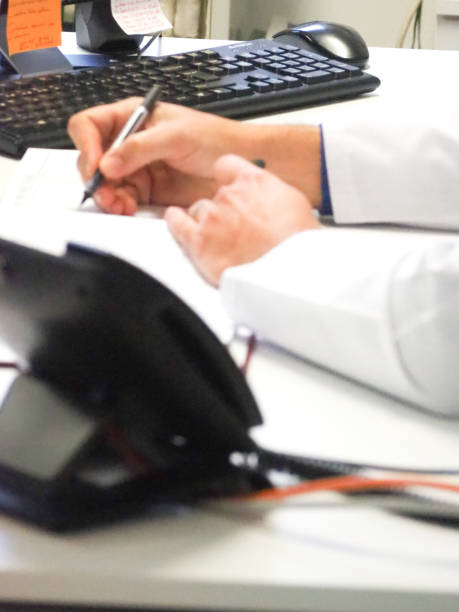 istock doctor working in his own practice 1454660441