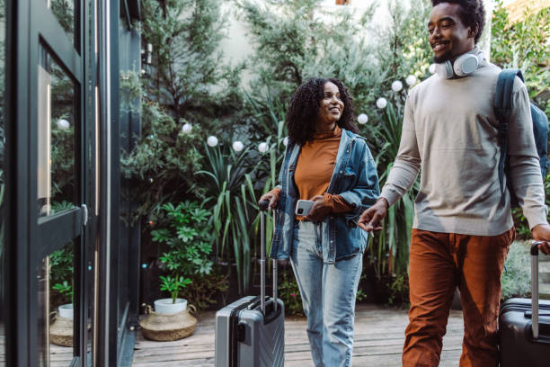 istock African-American tourists with suitcases 1454662028