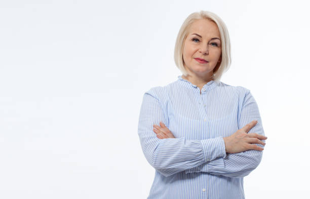 istock Attractive middle aged woman with folded arms on white background 1454663720
