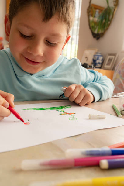 istock Little boy painting 1454664981