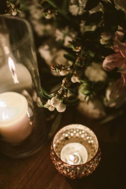istock Candle and flowers decoration on a wooden table 1454670817