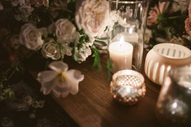 istock Candle and flowers decoration on a wooden table 1454671149