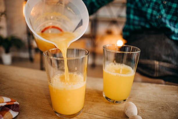Pouring a fresh and healthy orange juice! stock photo