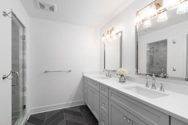 istock A bathroom with a grey cabinet and dark grey tiled floor. 1454675507
