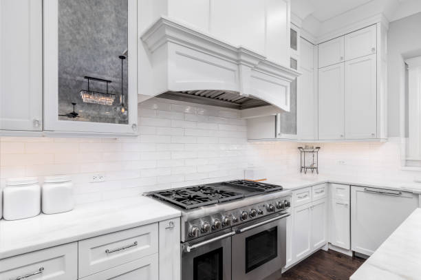 istock A white kitchen's hood and stainless steel oven. 1454675562