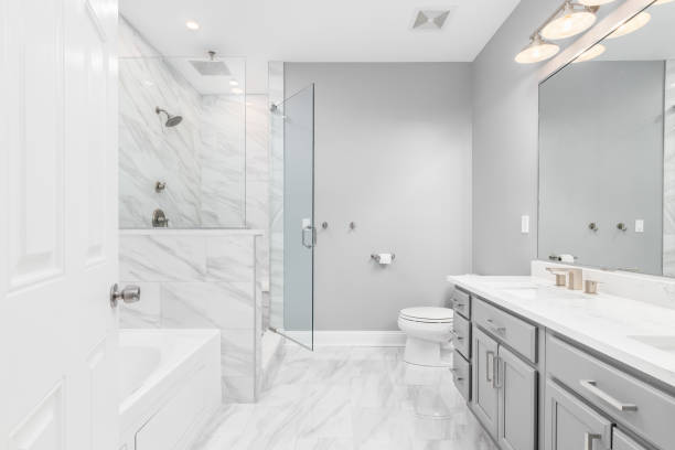 istock A bathroom with a grey cabinet and marble tiled floor. 1454675580