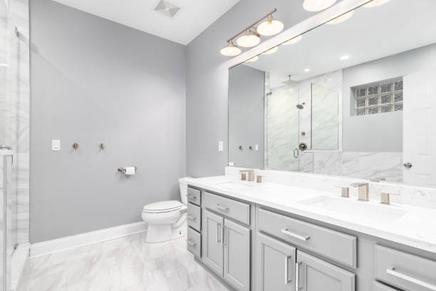istock A bathroom with a grey cabinet and marble tiled floor. 1454675594