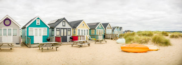 istock Beach huts on sandy beach, Hengistbury Head, Dorset, UK 1454675867
