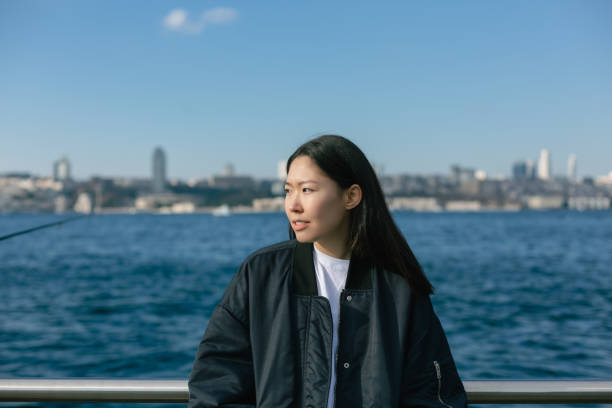 istock Young woman enjoying sunny weather 1454676527