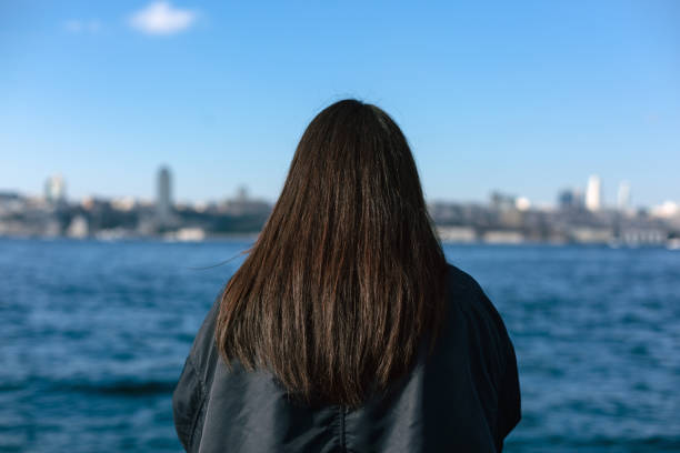 istock Young woman enjoying sunny weather 1454676790