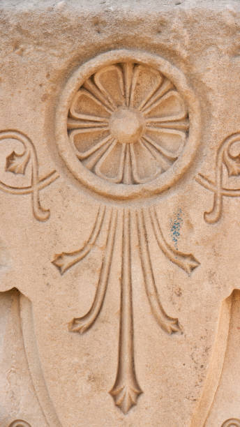 istock Carved ornament flower in stone wall 1454677061