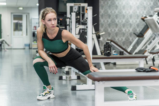 istock Stretching girl in the gym 1454677113