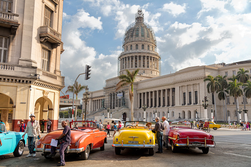 Havana, Cuba - September 28, 2015: Classic american car drive on street of Old Havana,Cuba. Classic American cars are typical landmark and tourist attraction for whole Cuban island.