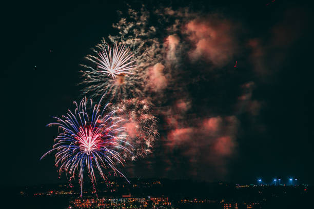 istock Beautiful colorful firework display on a black night sky on a celebration night 1454679559