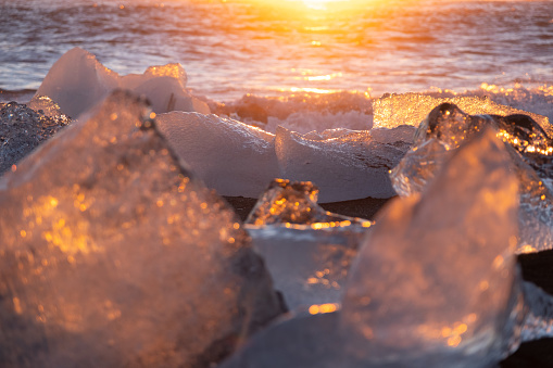 Diamond Beach in Iceland. Icebergs Shining on Black Volcanic Sand at Sunset. Clear Ice Crashed by Ocean Waves. Famous Tourist Location in North Europe Country. Travel Destination. High Resolution.