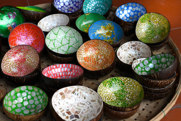 Multi colored coconut bowls for sale in Hoi An city.