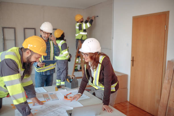 istock Team working on interior design on a meeting at site 1454688377