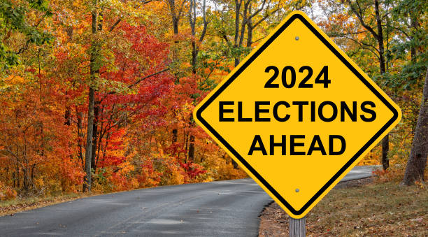2024 Elections Ahead Warning Sign 2024 Elections Ahead Caution Sign Autumn Background 2024 stock pictures, royalty-free photos & images
