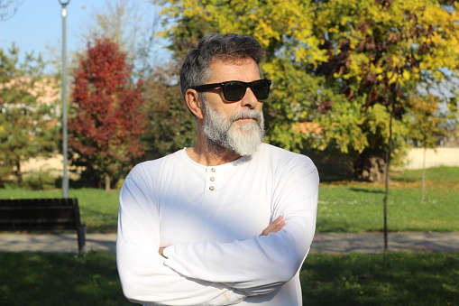 Posing poses mature man model sunglasses sunny day bearded modern