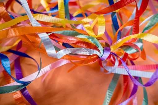 Ribbons bunched up and twisted together in an abstract fusion of colours