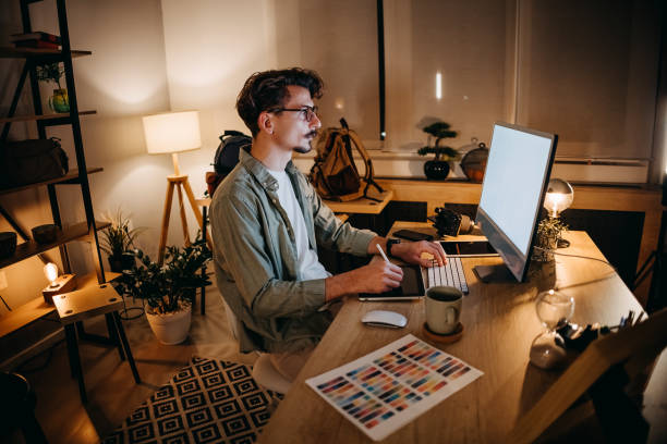 istock Graphic designer works in his office 1454695127