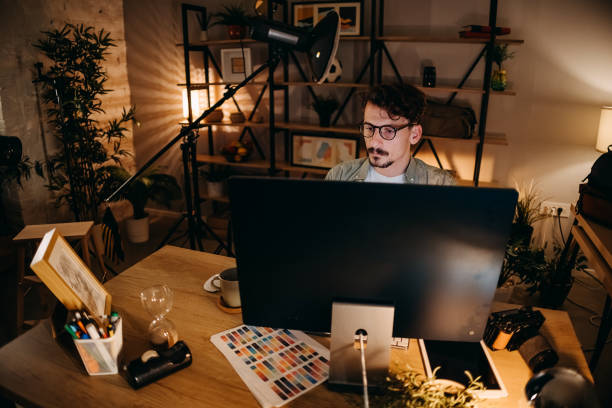 istock Graphic designer works in his office 1454695200