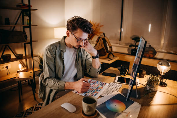 istock Graphic designer works in his office 1454695251