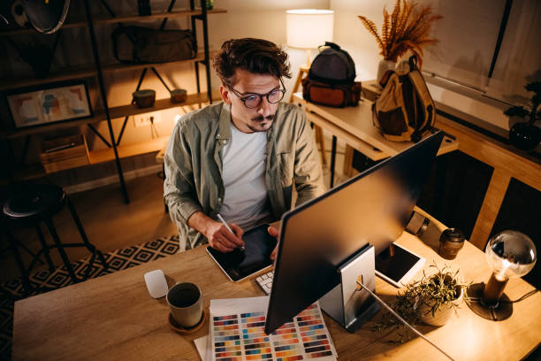 Graphic designer works in his office stock photo