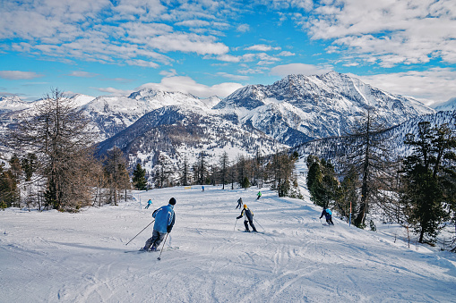 Skiers on top at winter ski resort Hintertux, Tirol, Austria.