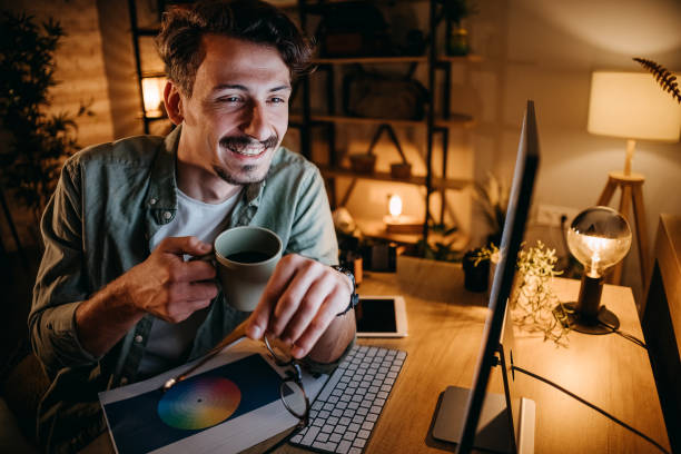 istock Graphic designer works in his office 1454696325