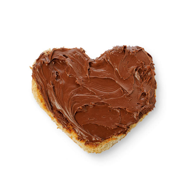 Rusk bread in the form of a heart with Chocolate Spread on Toast isolated on a white background stock photo