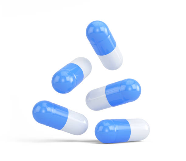 blue medicine capsule pillole isolate su sfondo bianco. medicina, concetto di farmacia. rendering 3d - blue medicine narcotic healthy lifestyle foto e immagini stock