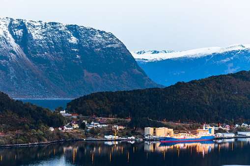 Beautiful night landscape with fjord. Scandinavia. Twilight in mountains