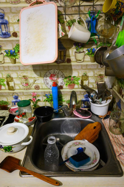 istock Dirty washing up in sink 1454701003